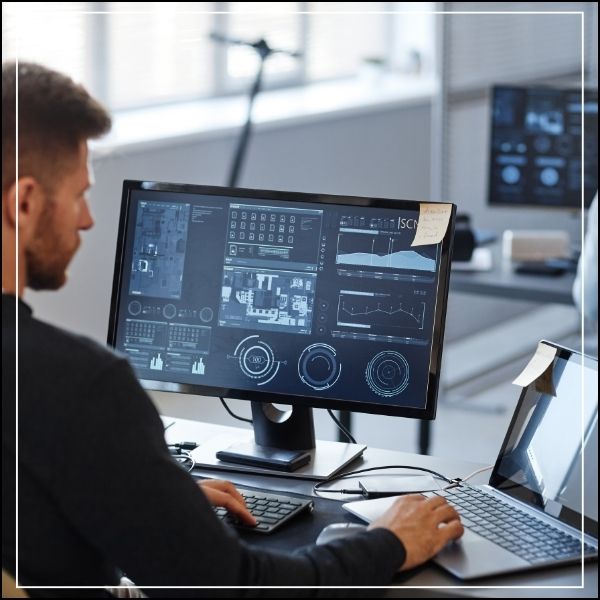 IT specialiste working on a computer system. A career after studying BA Inforation Technology at Conley University.